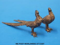 A pair of hallmarked cast silver pheasants,