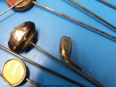 Two white metal hat pins both in the form of two thistles intertwined,