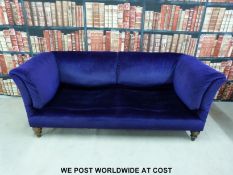 A late Victorian/ Edwardian Howard sofa with impressed marks to back legs (Length 190cm)