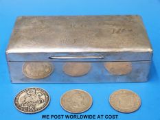 A signed hallmarked silver cigarette box,