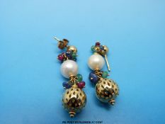A pair of 18ct gold earrings set with a large pearl, emerald,