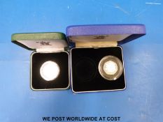 A cased 1998 25th anniversary EEC silver proof 50 pence piedfort together with a 1992 silver 10
