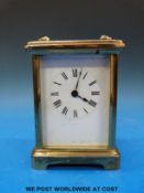 A brass-cased carriage timepiece in corniche style case