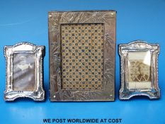 A pair of small hallmarked silver picture frames and one other Chinese plated example