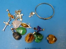 A silver cross and chain, three heart shaped pendants one rose quartz,