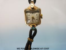 A Huguenin yellow metal ladies wristwatch with Swiss movement marked to the case 20 and RW either