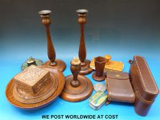 A collection of treen including turned oak candlesticks, pedestal bowl, vase, lighter,