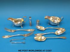 A hallmarked silver sauce boat (111g), together with a plated example,