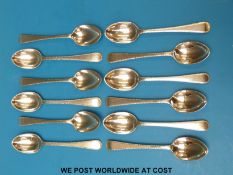 A set of 12 hallmarked silver feather-edged teaspoons (256g)