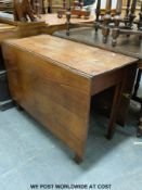 An antique elm drop leaf table (height 68cm length 154cm length 98cm)