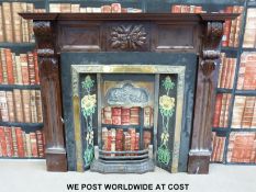 A 19th or early 20th century tiled fireplace with brass fittings