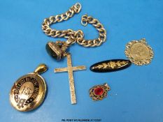 A silver bracelet set with silver and bloodstone fob, silver cross, mourning locket,