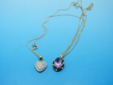A 9ct gold pendant set with an amethyst and a 9ct gold pendant set with diamonds,