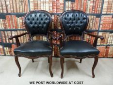 Two leather upholstered armchairs