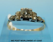 An 18ct gold ring set with an old cut diamond (0.