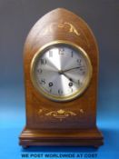 A late 19thC / early 20thC two-train mantel clock with inlaid mitre shaped case,