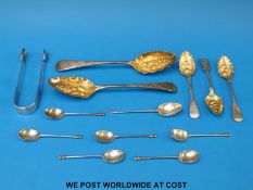 A pair of Georgian hallmarked silver berry spoons, three smaller berry spoons, sugar tongs,
