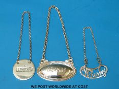 Three hallmarked silver bottle labels comprising fretwork Whisky,
