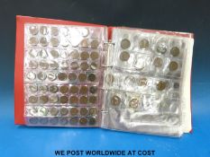 A red 'Magpie Collectors' coin album containing schoolboy/ amateur collection of coins including