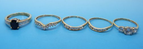 Four 14ct gold rings all set with cubic zirconia and another ring