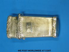A hallmarked silver etui with engine-turned and engraved interior,