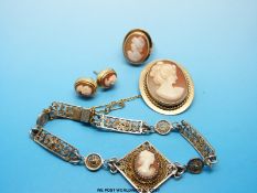 A suite of 9ct gold and cameo jewellery comprising brooch, earrings and ring,