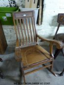 A brass inlaid and carved Northern Indian rocking chair