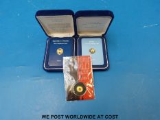 Three miniature gold coins comprising a Panama cased proof 2.14g .