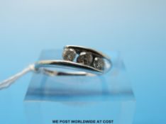 A 9ct gold ring set with three diamonds (size K)