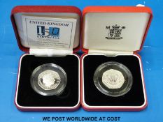 Two cased fifty pence piedfort coins NHS and Public Libraries examples with certificates