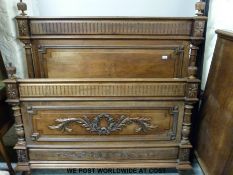 A carved French walnut double bed (width 149cm)