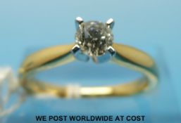 An 18ct gold ring set with a round brilliant cut diamond measuring approx 0.