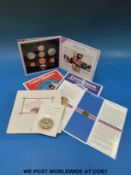 Five uncirculated UK coin collection packs together with a £5 and a £1 example