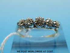 A yellow metal ring set with five diamonds (size O/P)