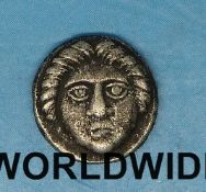 An Ancient Greek silver coin face in bust
