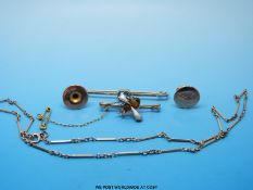 A yellow metal stick pin set with an aquamarine,