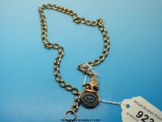 A yellow metal Victorian watch chain with yellow metal fob featuring an eagle set with intaglios