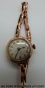 A 9ct gold cased ladies wristwatch on expanding strap (marked 9ct)