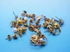 Nine pairs of 9ct gold earrings,