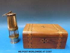 A green and clear glass drop light fitting, inlaid box and miner's lamp.