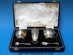 A cased hallmarked silver three piece cruet set, B'ham 1967,