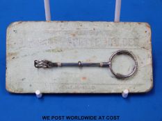 An Art Deco hallmarked silver finger cigarette holder on original cord, B'ham 1930,