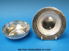 A hallmarked silver bowl with pierced edge together with a hallmarked silver dish with embossed and