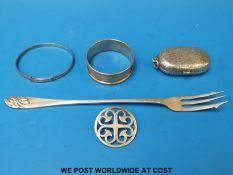 A Victorian hallmarked silver double sovereign holder with chased decoration, a silver napkin ring,
