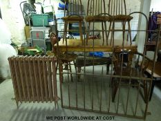 A probably 19thC wrought iron gate with hoop top together with a cast iron radiator (gate H128 x