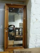A large pine wall mirror (139 x 62cm)