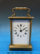 A brass cased carriage clock with keyless movement