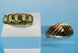 A 9ct gold ring set with five peridots (size Q) and a 9ct gold ring (size R)
