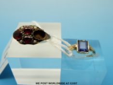 A 9ct gold ring set with an emerald cut amethyst and a 9ct gold ring set with seed pearls and