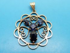 A yellow metal pendant marked 9ct gold set with four sapphires (possibly from Ceylon)